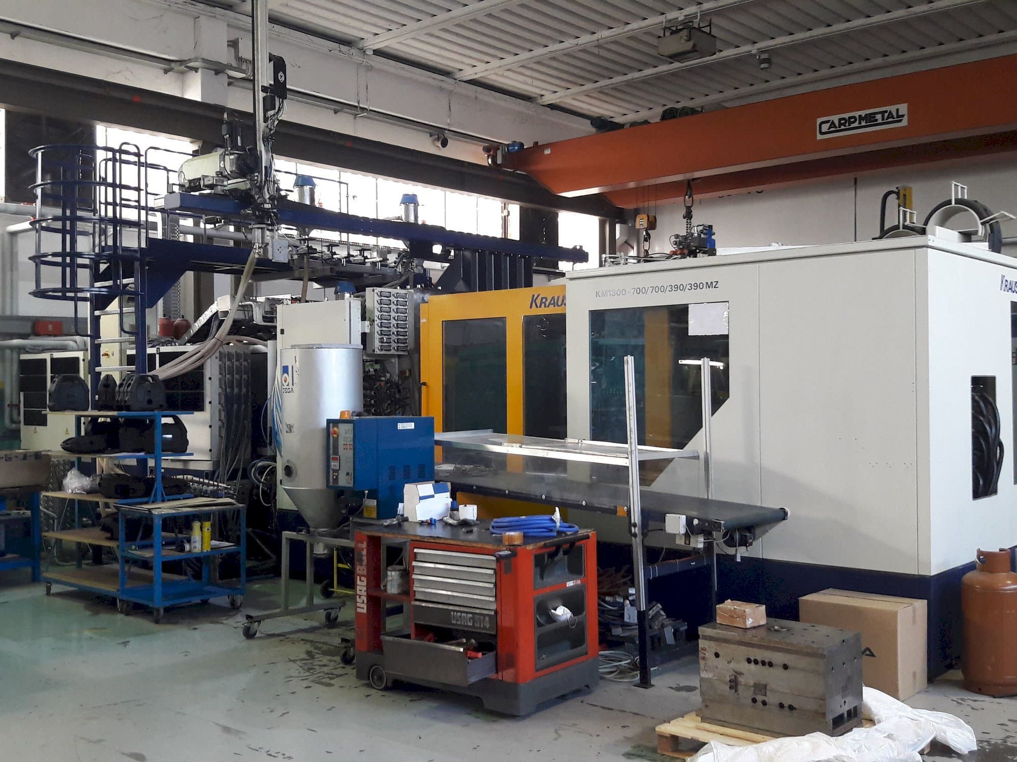 Front view of Krauss Maffei 1300-700-700-390-390 MZ  machine