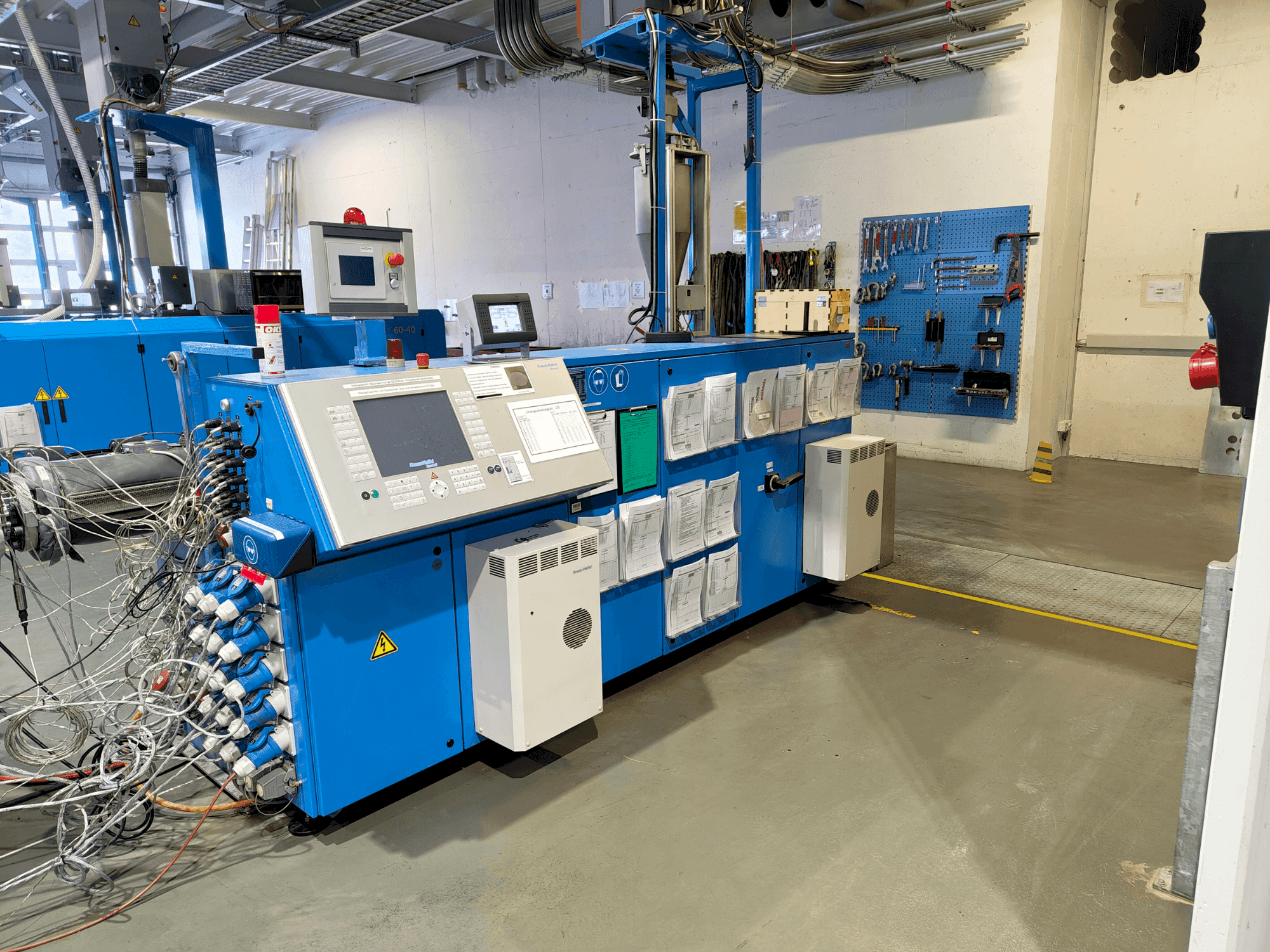 Front view of Krauss Maffei KME 75-36 R AC  machine
