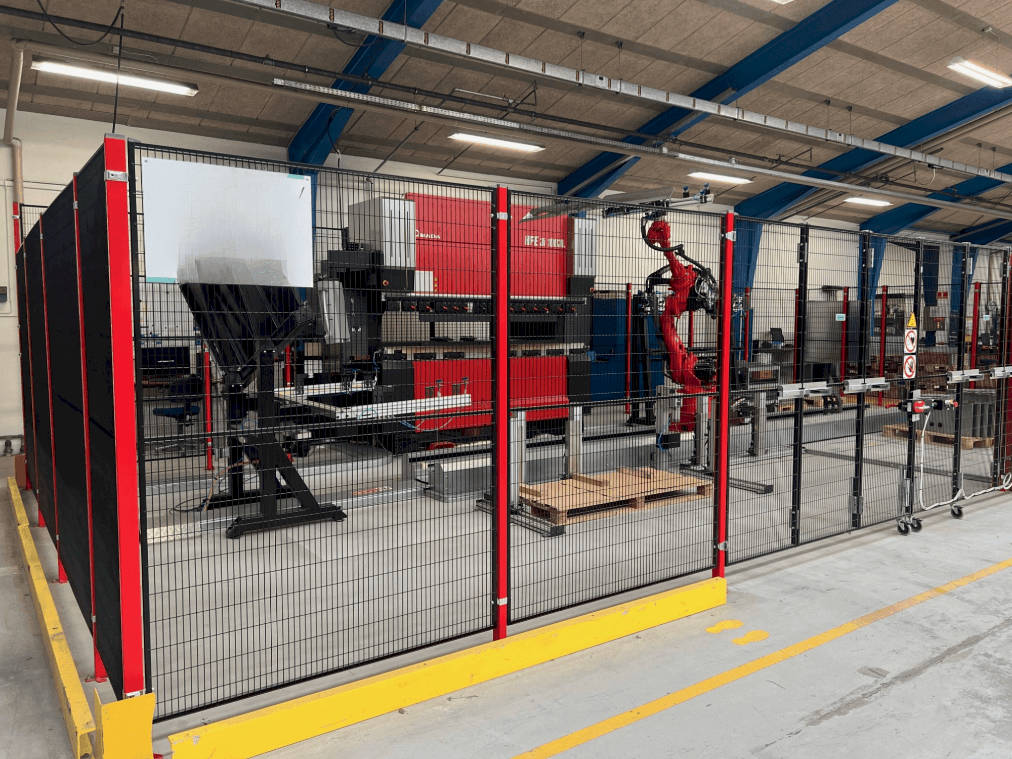 Front view of AMADA HFE3i 1003 8 axes L  machine